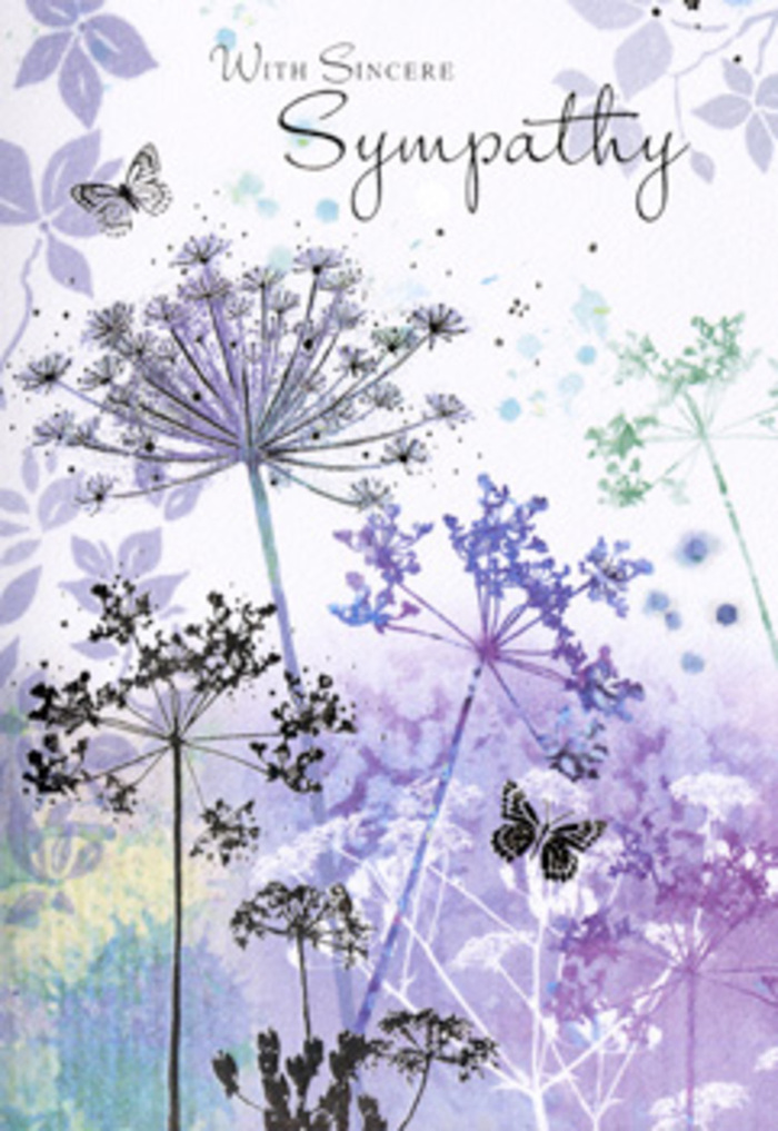 The image inside this sympathy card carries a peaceful, almost meditative beauty, like pausing on a quiet corner of Leamouth and simply watching the sky. Tall, slender wildflowers rise in graceful arcs, their stems fine and slightly wavering, crowned with intricate clusters of tiny umbel blooms. These filigree flower heads are rendered in gentle shades of violet, indigo, and cool blue, with hints of grey-green that soften the edges. Each bloom appears carefully etched yet softened by watercolour, so the flowers feel both detailed and dreamlike at the same time. Behind them, the background dissolves into softly blurred washes of lavender and pale blue, reminiscent of early-morning mist drifting over the bends of the River Lea. Two delicate butterflies hover just above the wispy petals, their wings thin and almost see-through, suggesting both fragility and continuity-life still moving, even in sorrow. The light across the design is diffuse and low, without sharp shadows, giving the entire scene a hushed, reflective mood. As a florist familiar with the quiet needs of families in Leamouth at difficult times, I see this card as more than a simple message; it feels like an invitation to pause, breathe, and remember. It would sit beautifully beside a soft, pastel condolence arrangement delivered to a home by Orchard Place or a chapel nearby, its gentle imagery offering wordless comfort. The overall impression is one of respectful sympathy: nature's endurance translated into tender colour and line.